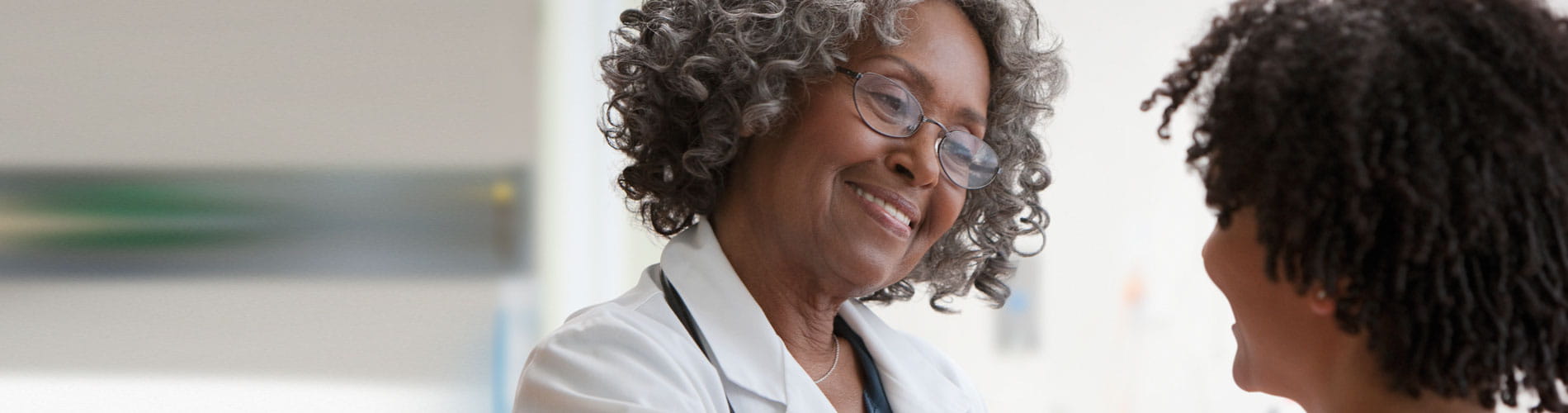 BCR_ABL1, Female African doctor talking to female patient